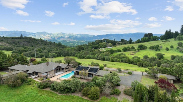 birds eye view of property featuring a mountain view and a rural view