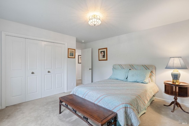 carpeted bedroom with a closet