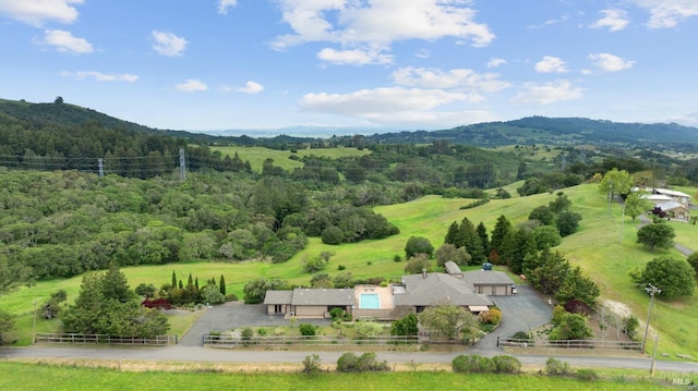 drone / aerial view with a mountain view and a rural view