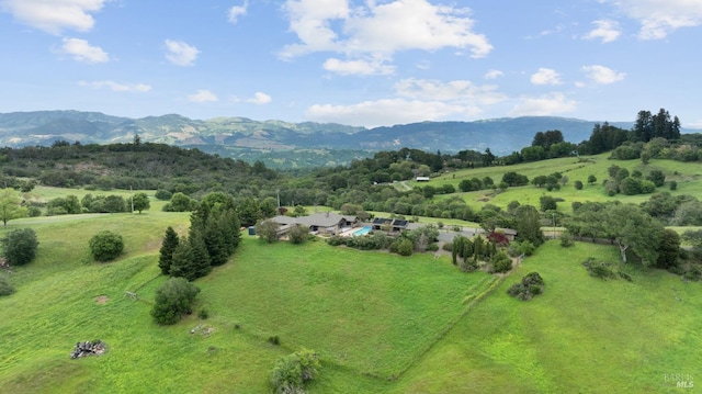 bird's eye view featuring a rural view and a mountain view