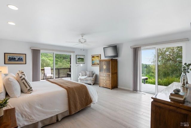 bedroom featuring multiple windows, ceiling fan, light hardwood / wood-style flooring, and access to outside