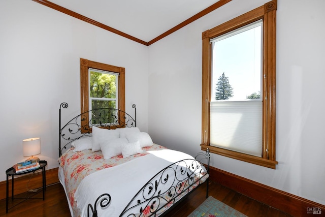 bedroom featuring dark wood-type flooring and crown molding