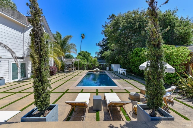 view of pool featuring a patio and a diving board