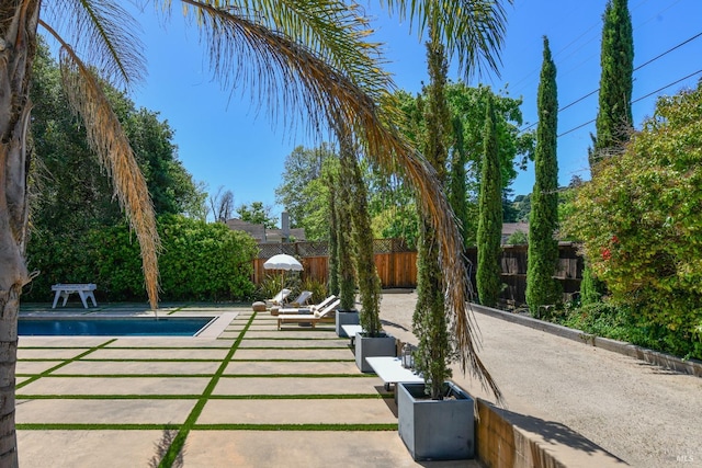 view of patio / terrace featuring a fenced in pool