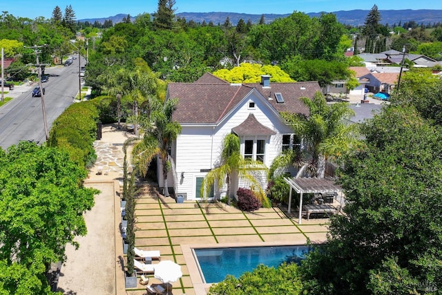 birds eye view of property with a mountain view