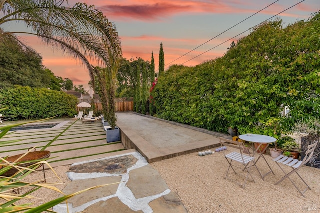 view of patio terrace at dusk