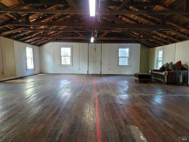 interior space featuring wood ceiling and wood walls