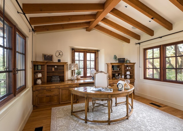 office area with vaulted ceiling with beams and light wood-type flooring