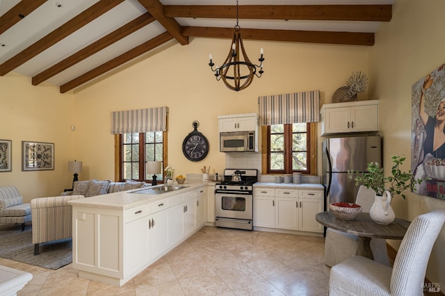 kitchen with pendant lighting, sink, white cabinetry, stainless steel appliances, and kitchen peninsula