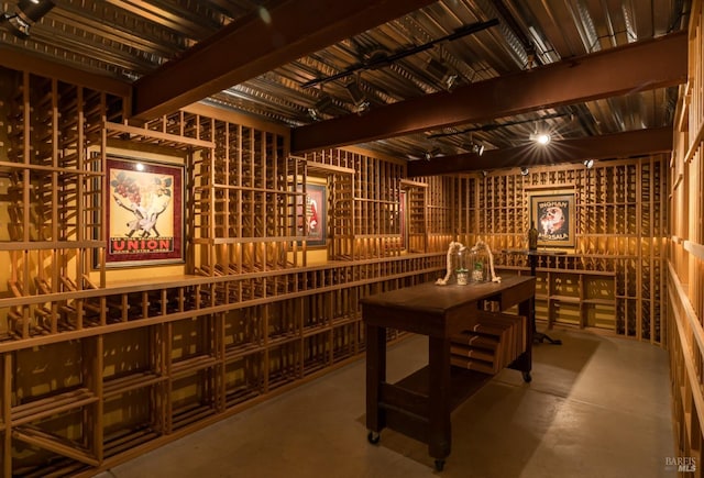 wine cellar featuring concrete flooring