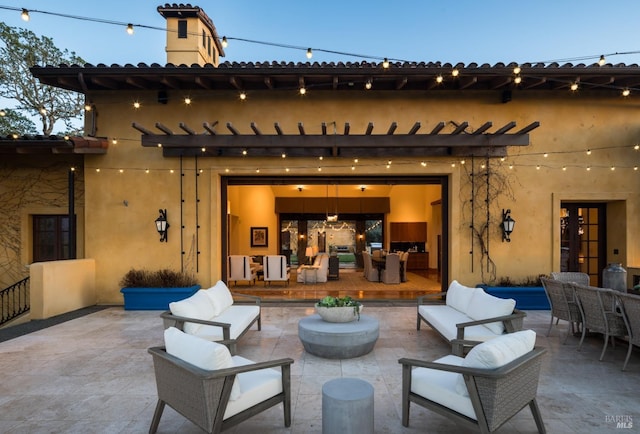 patio terrace at dusk with an outdoor living space