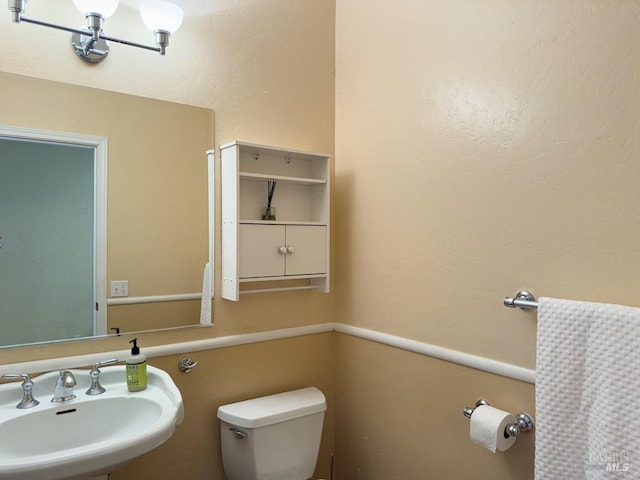 bathroom with toilet and sink