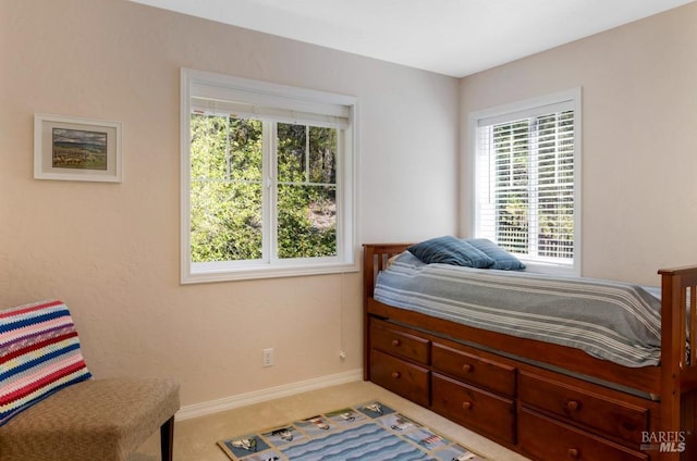 bedroom with light colored carpet