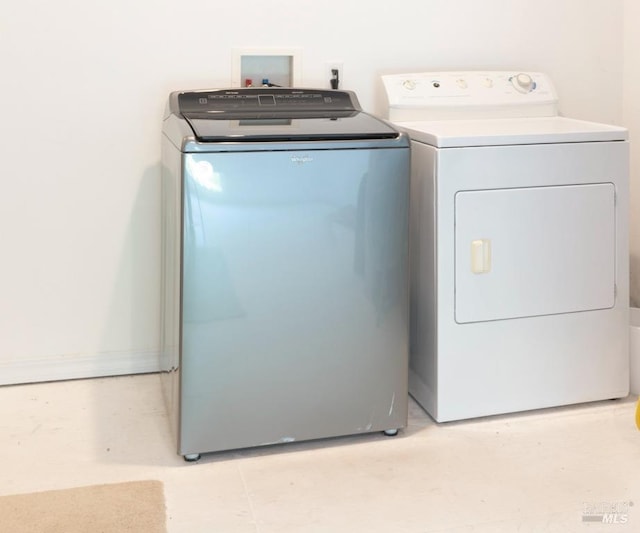 clothes washing area featuring washing machine and clothes dryer