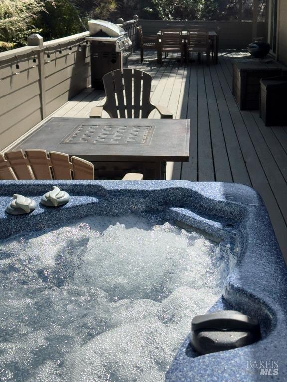 exterior space featuring a hot tub