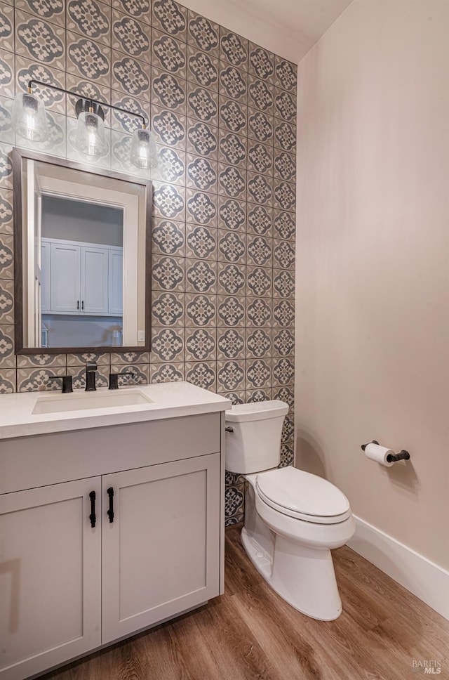 laundry room with cabinets, light hardwood / wood-style floors, and washer and clothes dryer