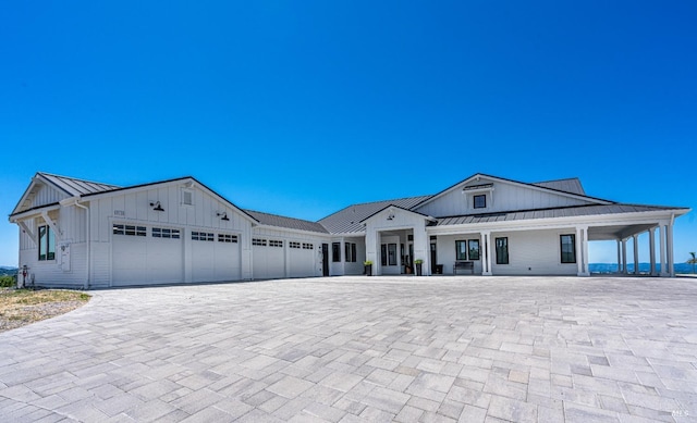 modern inspired farmhouse featuring a garage