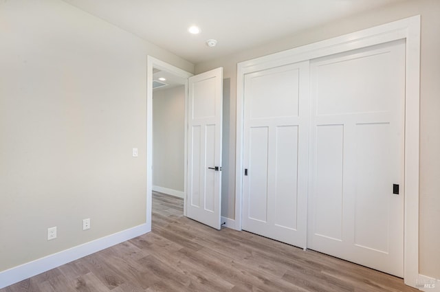 bathroom featuring toilet, vanity, tile patterned floors, and a shower with shower door