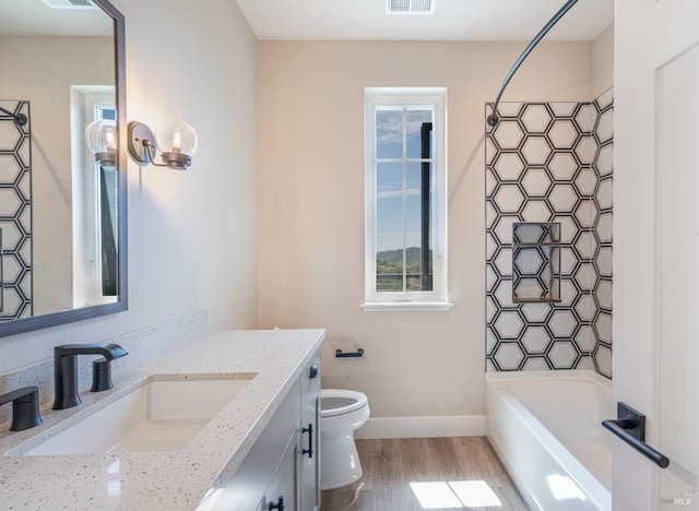 laundry room featuring dark hardwood / wood-style flooring and stacked washer and clothes dryer