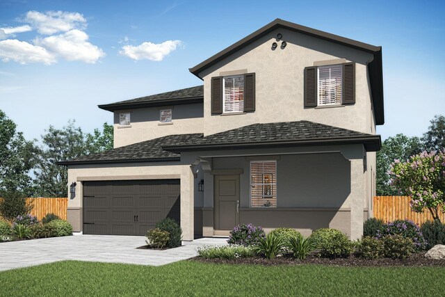 view of front of house with a front yard and a garage