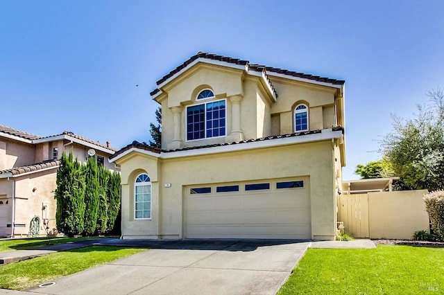 mediterranean / spanish-style home with a garage