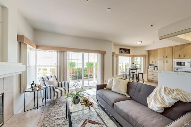 tiled living room with a tiled fireplace