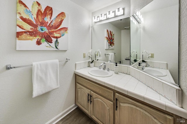 bathroom featuring hardwood / wood-style flooring and vanity