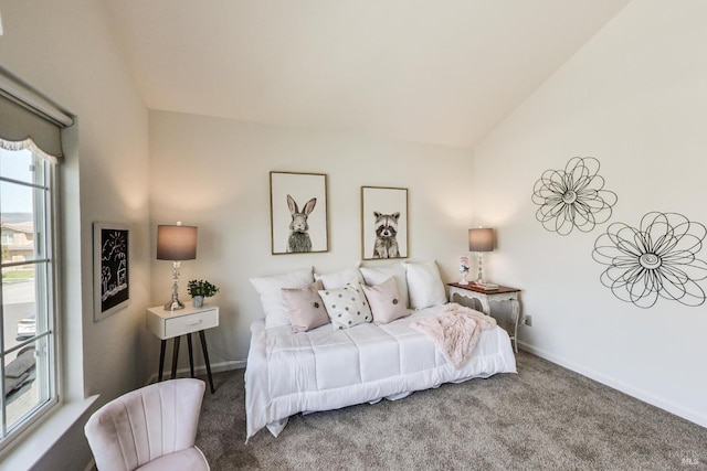 carpeted bedroom with vaulted ceiling