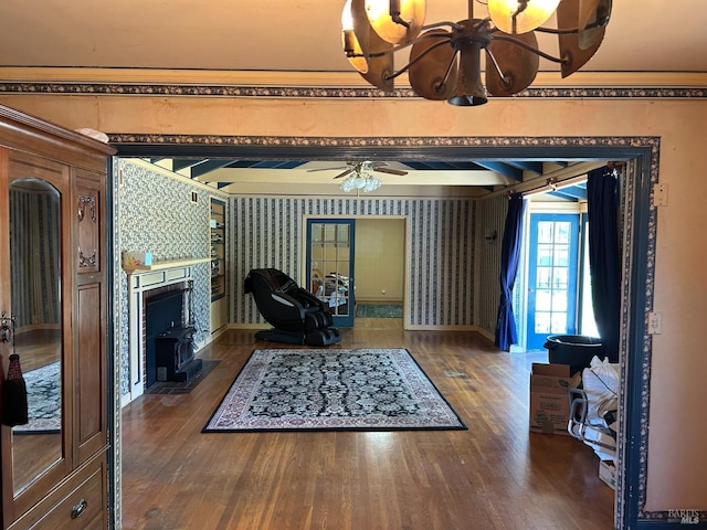 living room with dark hardwood / wood-style flooring and ceiling fan