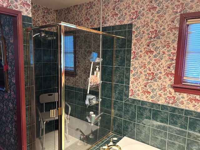 bathroom with a shower with shower door