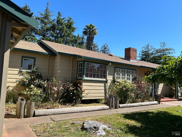 ranch-style house with a front lawn