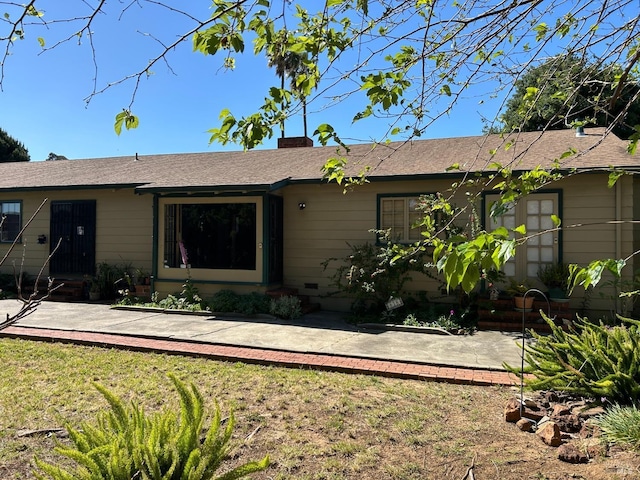 single story home featuring a patio and a front lawn