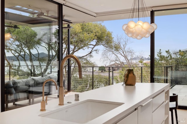 view of patio / terrace with a balcony and sink