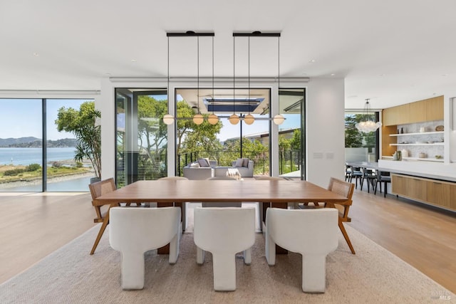 431 E Strawberry Dr, Mill Valley, CA 94941 - dining area featuring expansive windows, light wood-style floors, and a water view