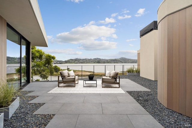 431 E Strawberry Dr, Mill Valley, CA 94941 - view of patio featuring an outdoor living space and a water view