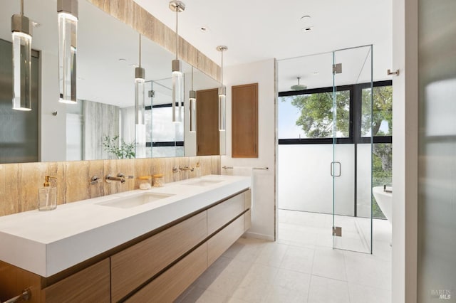 bathroom featuring vanity, backsplash, tile patterned floors, and independent shower and bath