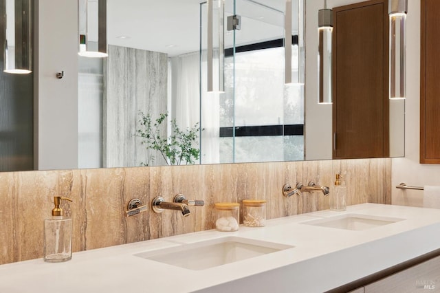 bathroom featuring vanity and backsplash