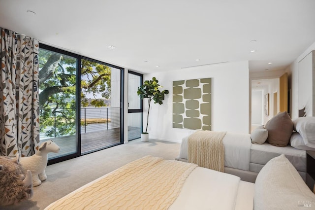 carpeted bedroom with floor to ceiling windows and access to outside