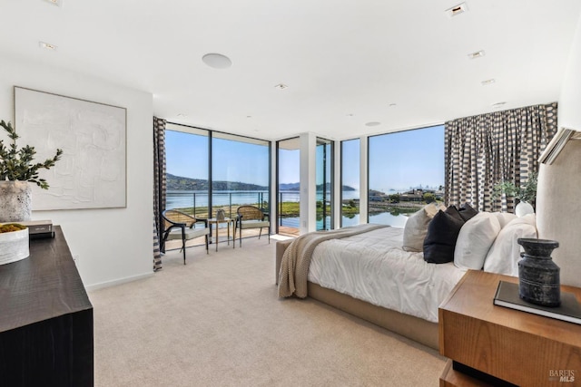 431 E Strawberry Dr, Mill Valley, CA 94941 - carpeted bedroom featuring a water view and a wall of windows