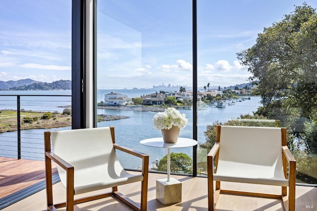 balcony with a water and mountain view