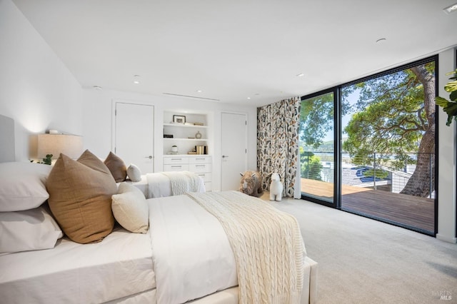 431 E Strawberry Dr, Mill Valley, CA 94941 - carpeted bedroom with access to outside and floor to ceiling windows