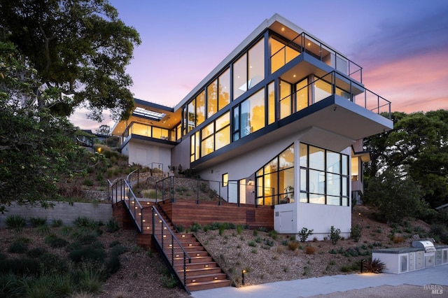 431 E Strawberry Dr, Mill Valley, CA 94941 - contemporary house with stairs, a balcony, and stucco siding