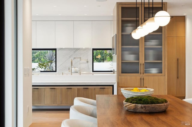 interior space with radiator heating unit and light hardwood / wood-style flooring