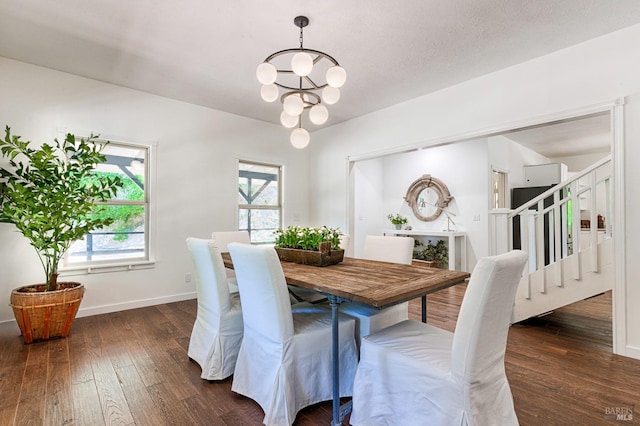 dining room with a chandelier and dark wood-type flooring