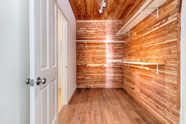 spacious closet featuring hardwood / wood-style floors