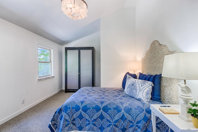 bedroom featuring an inviting chandelier, lofted ceiling, baseboards, and carpet floors