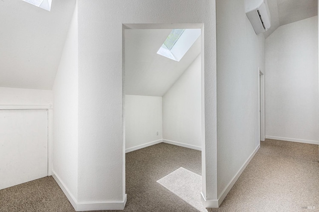 bonus room with a wall mounted air conditioner, baseboards, vaulted ceiling with skylight, and carpet floors