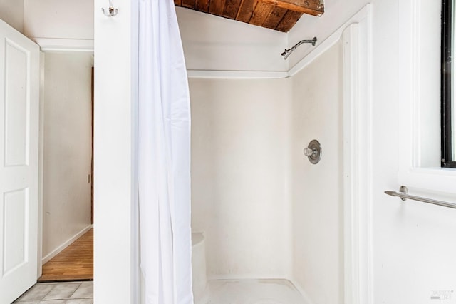 bathroom featuring lofted ceiling, wood ceiling, curtained shower, and hardwood / wood-style floors