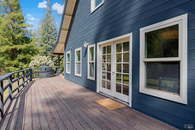 wooden deck featuring french doors