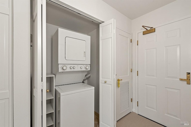 washroom with stacked washer and dryer